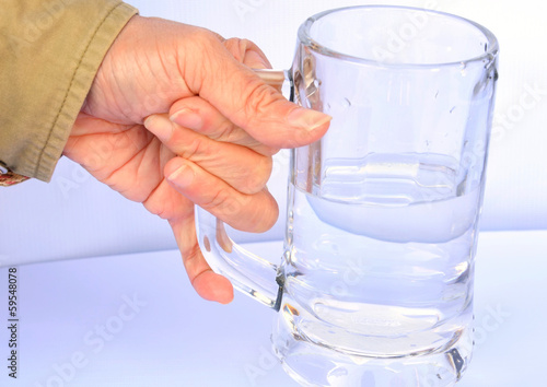 hand and glass water