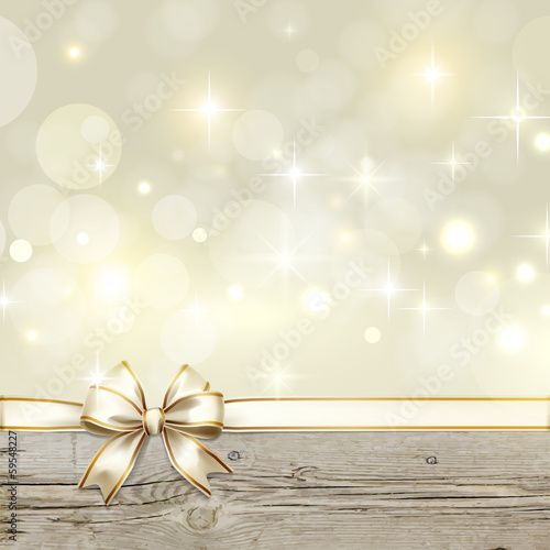 Golden ribbon bow with bokeh Christmas decoration