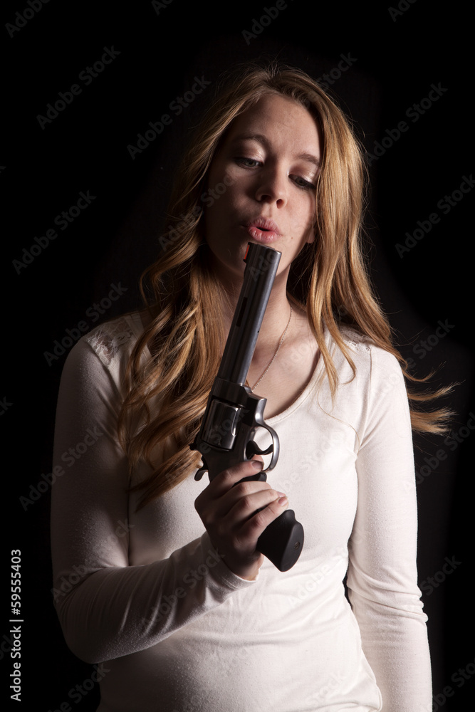 woman in low light blow gun Stock Photo | Adobe Stock