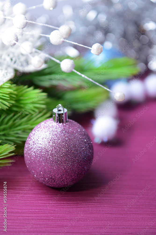 Christmas balls on fir tree, on color background Christmas balls on fir tree, on color background