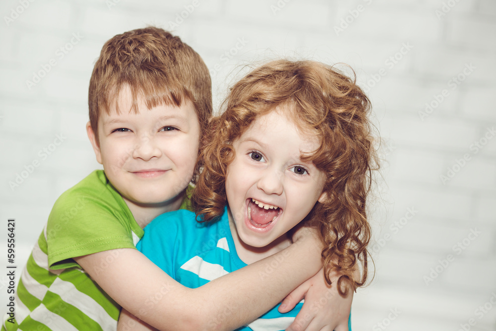 Happy brother and sister smiling and embracing. Happy brother and sister smiling and embracing.