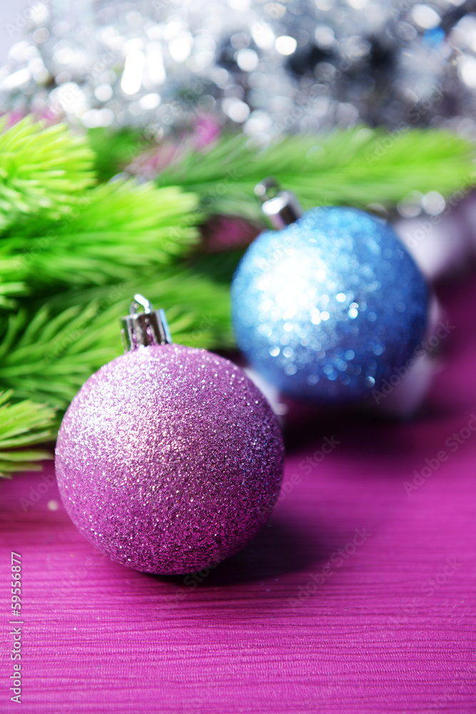 Christmas balls on fir tree, on color background Christmas balls on fir tree, on color background