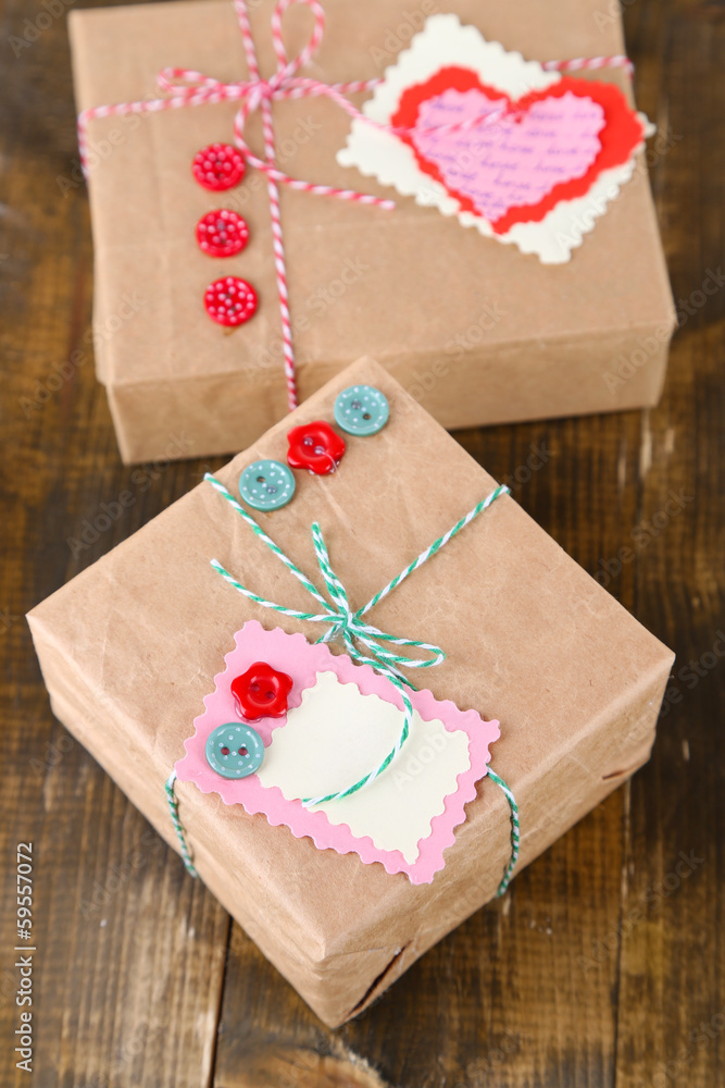Paper gift boxes on wooden background Paper gift boxes on wooden background