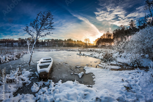 Winter sunrise on the frozen lake © shaiith