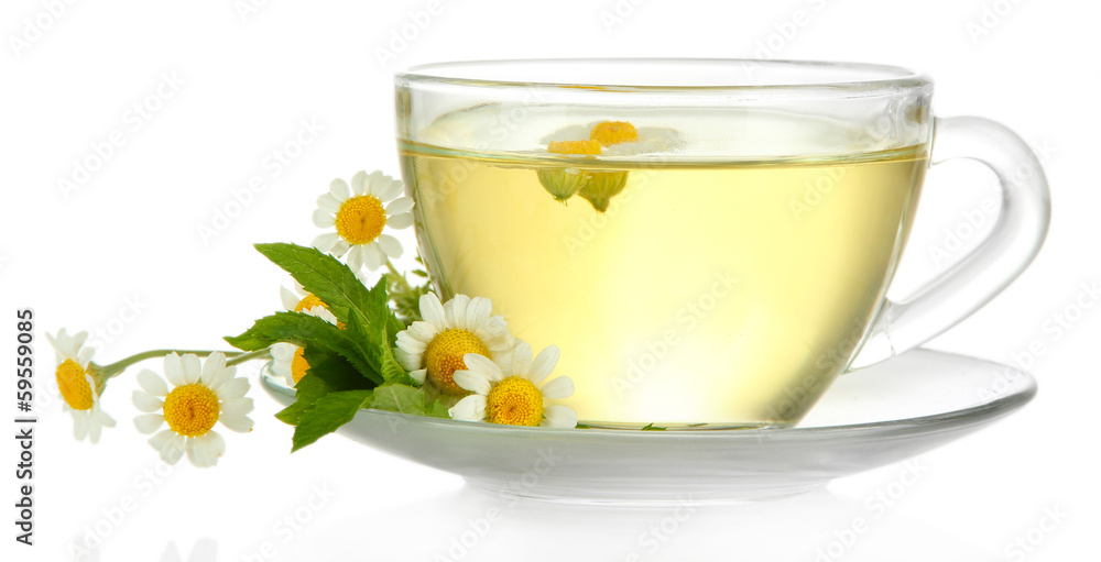 Cup of herbal tea with wild camomiles and mint, isolated Cup of herbal tea with wild camomiles and mint, isolated