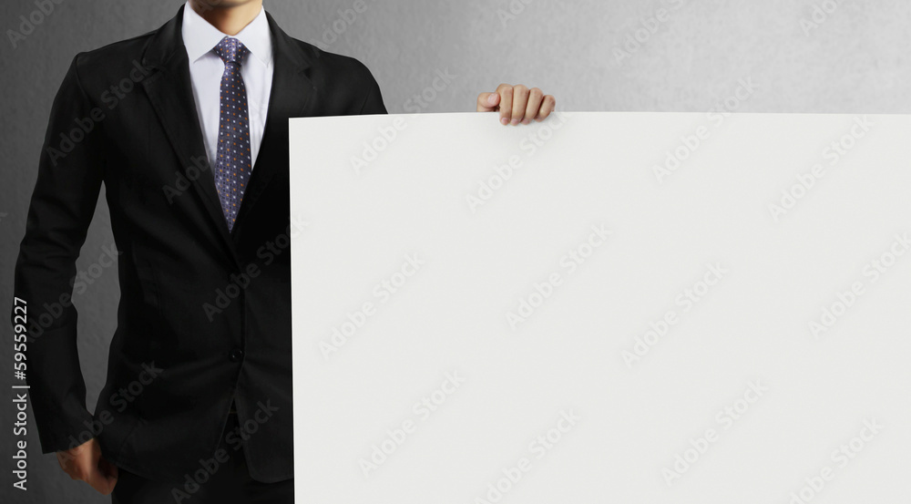 Business man handing blank business card over Business man handing blank business card over