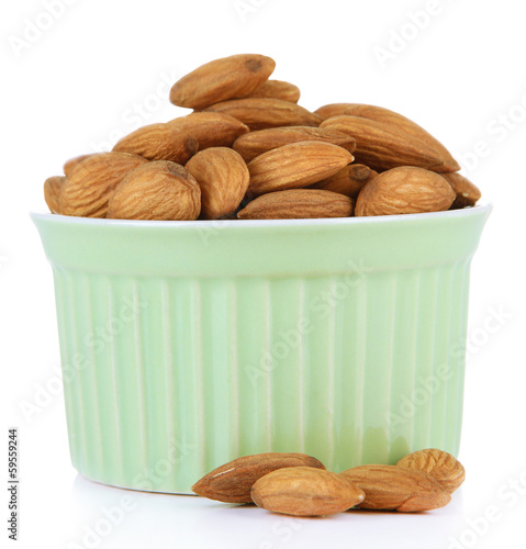 Almond in bowl, isolated on white