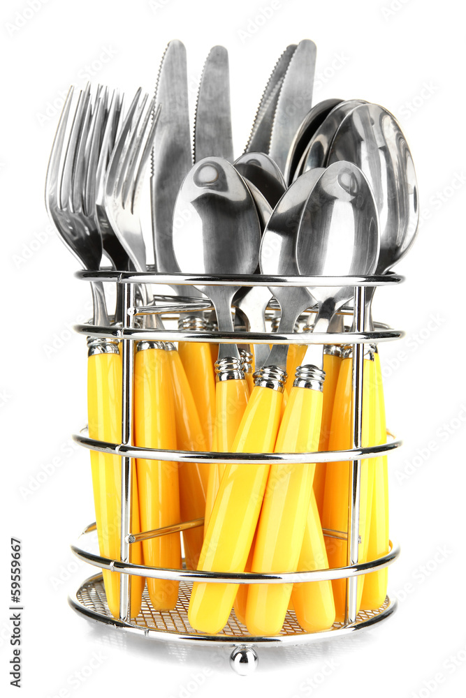 Knives, forks and spoons in metal stand isolated on white Knives, forks and spoons in metal stand isolated on white