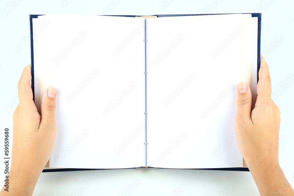 Book in hands isolated on white Book in hands isolated on white