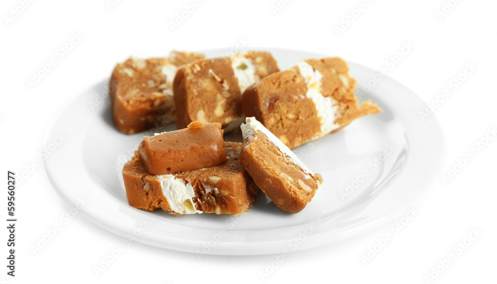 Sherbet with nuts on plate isolated on white Sherbet with nuts on plate isolated on white