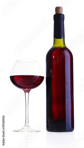 Wineglass with red wine and bottle isolated on white