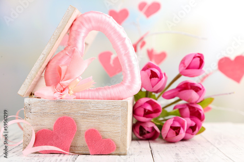 Romantic still life with heart in wooden casket