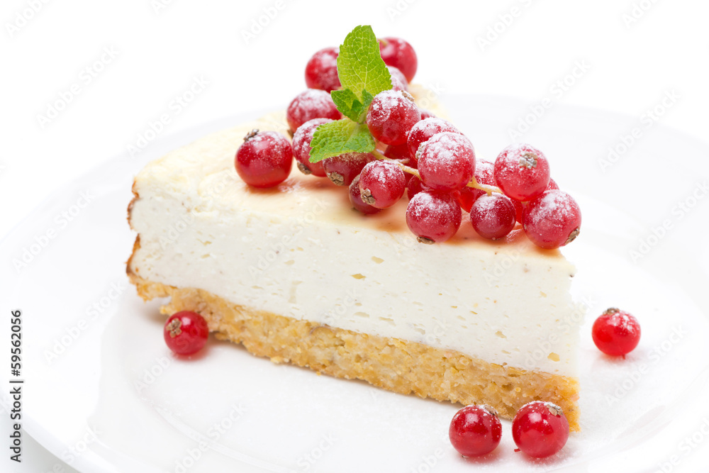 vanilla cheesecake with red currants on a plate vanilla cheesecake with red currants on a plate