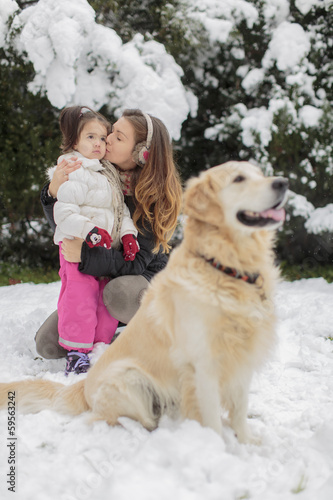 Family with a dog at winter
