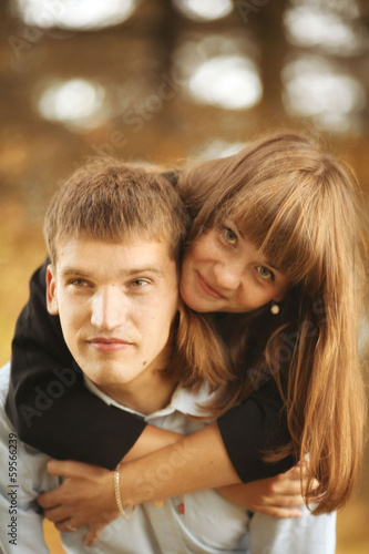 embracing and kissing young guy and girl on nature © kichigin19
