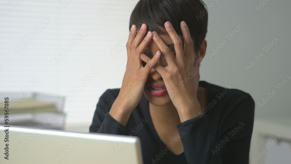 Black business woman expressing frustration at work Black business woman expressing frustration at work