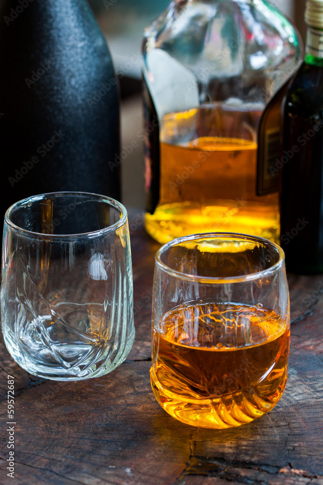 Golden Brown Whisky on the rocks in a glass Golden Brown Whisky on the rocks in a glass
