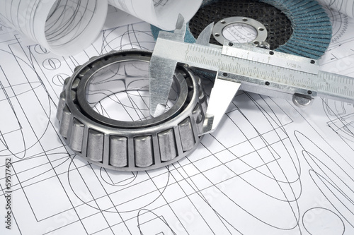 roller bearings, gauge, grinding disc  and drawings photo