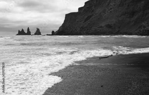 Iceland. South area. Vik. Reynisdrangur rock pinacles and black photo