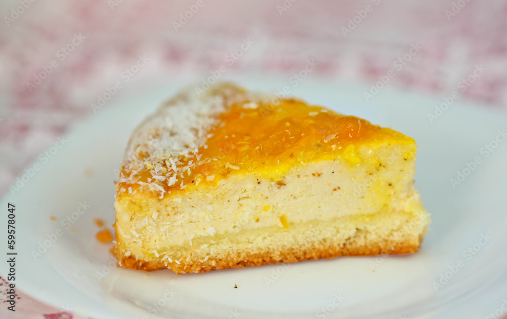 A piece of peach tart on a white plate A piece of peach tart on a white plate