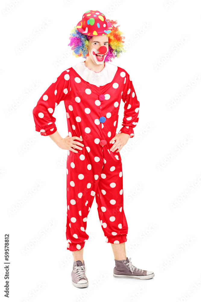 Fototapeta premium Full length portrait of a smiling happy clown in red costume
