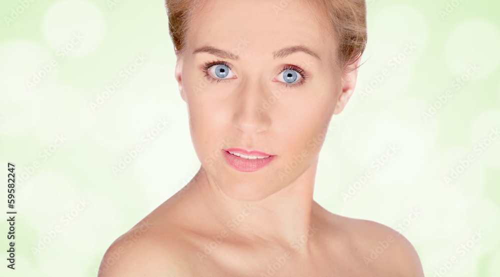 Naklejka premium Portrait of a beautiful woman with bright green background