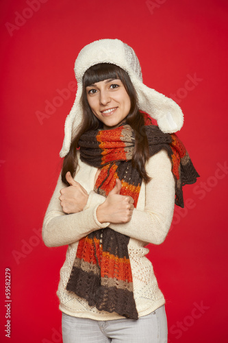 Winter girl showing thumbs up