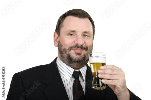 Smiling mature man with glass of lager
