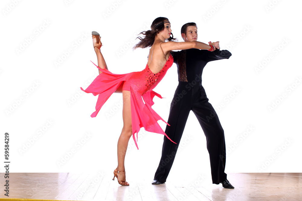 Fototapeta premium Latino dancers in ballroom against white background