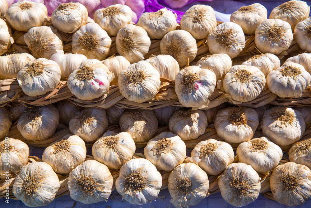Garlic bunches stacked in a row