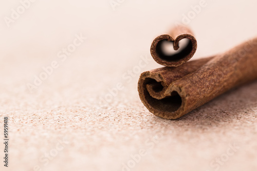 Cinnamon sticks on corkwood background. Space for text. photo