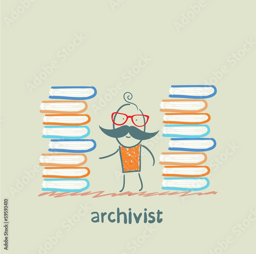 archivist standing near piles of books photo