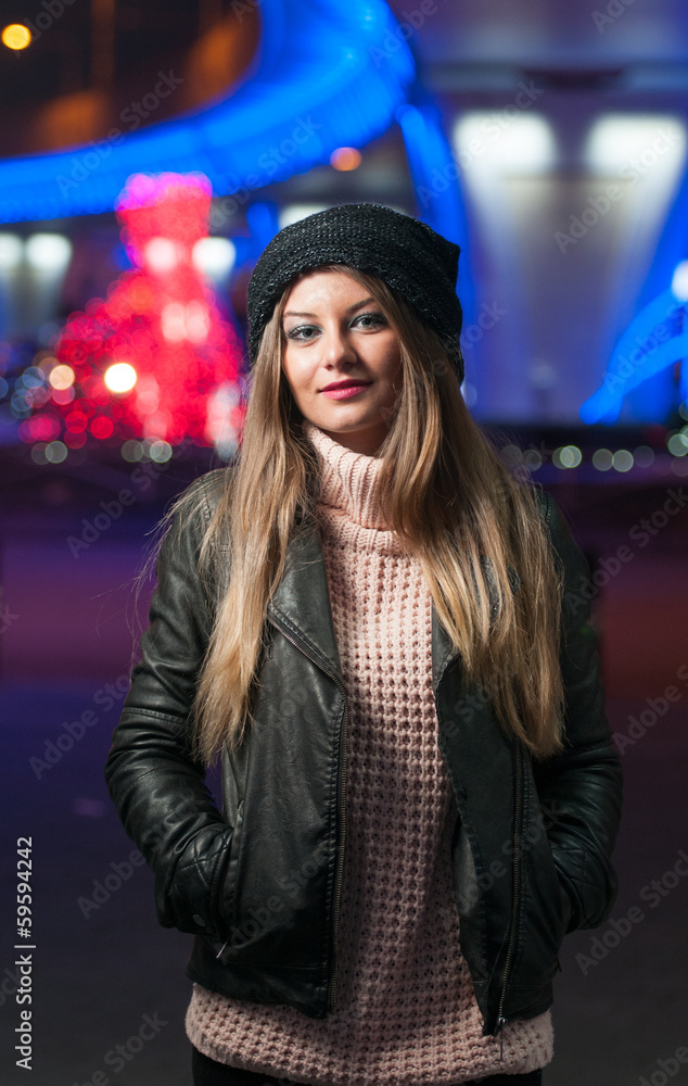 Fashionable lady wearing cap and black jacket outdoor in xmas Fashionable lady wearing cap and black jacket outdoor in xmas