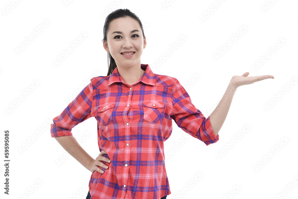 girl showing something on the palm of her hand and pointing girl showing something on the palm of her hand and pointing