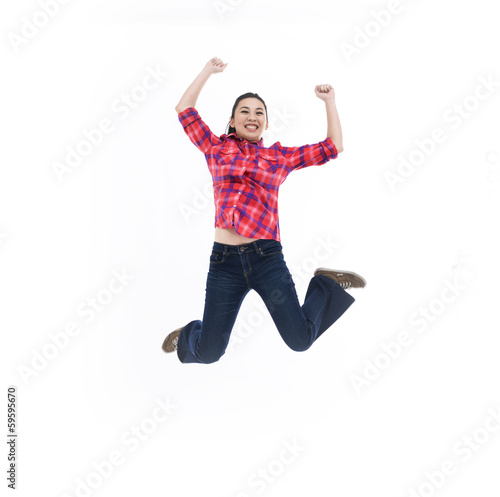 Full length studio shot of Jumping happy teen girl