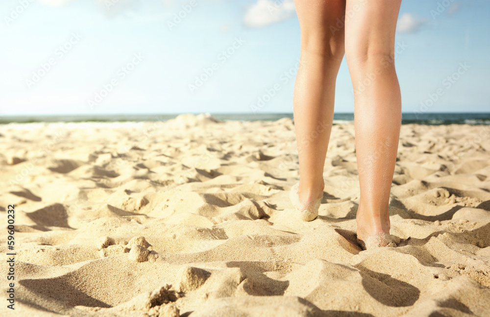 Close up of litle girl walking on the beach Close up of litle girl walking on the beach