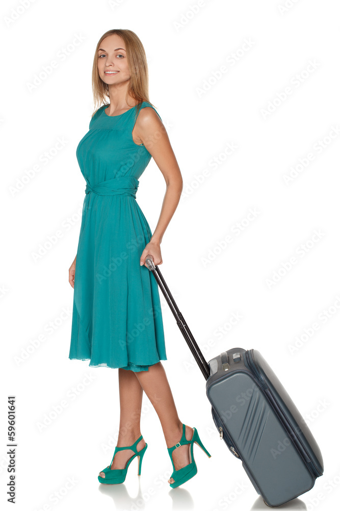 Girl standing with suitcase for travel and smiling Girl standing with suitcase for travel and smiling