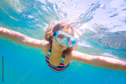 snorkeling blond kid girl underwater goggles and swimsuit © lunamarina