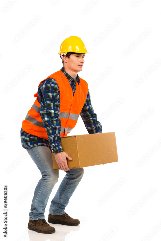 Crouching with a heavy package. Crouching with a heavy package.