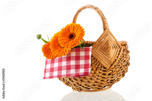 Orange marigolds in wicker basket