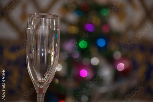glasses with defocused christmas tree in background