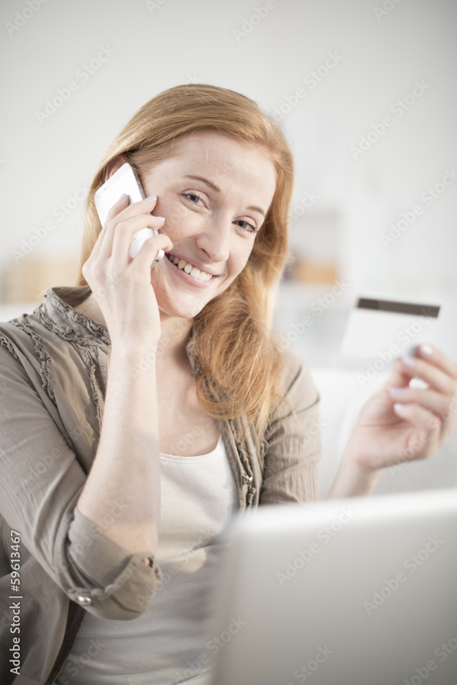 young woman at phone paying online ordering young woman at phone paying online ordering