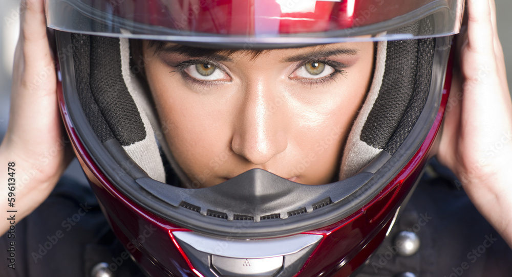 Attractive Girl Positions Red Full Face Helmet Before Motorcycle Attractive Girl Positions Red Full Face Helmet Before Motorcycle