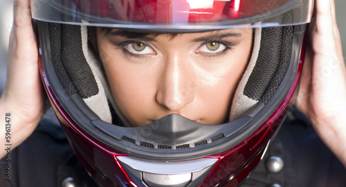Attractive Girl Positions Red Full Face Helmet Before Motorcycle © Christopher Boswell
