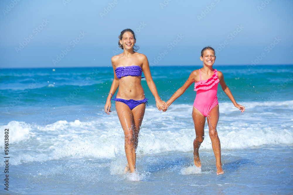 Girls running beach Girls running beach