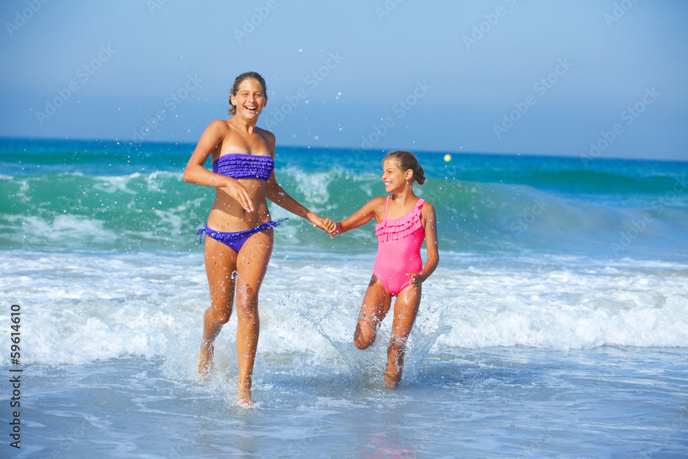 Girls running beach