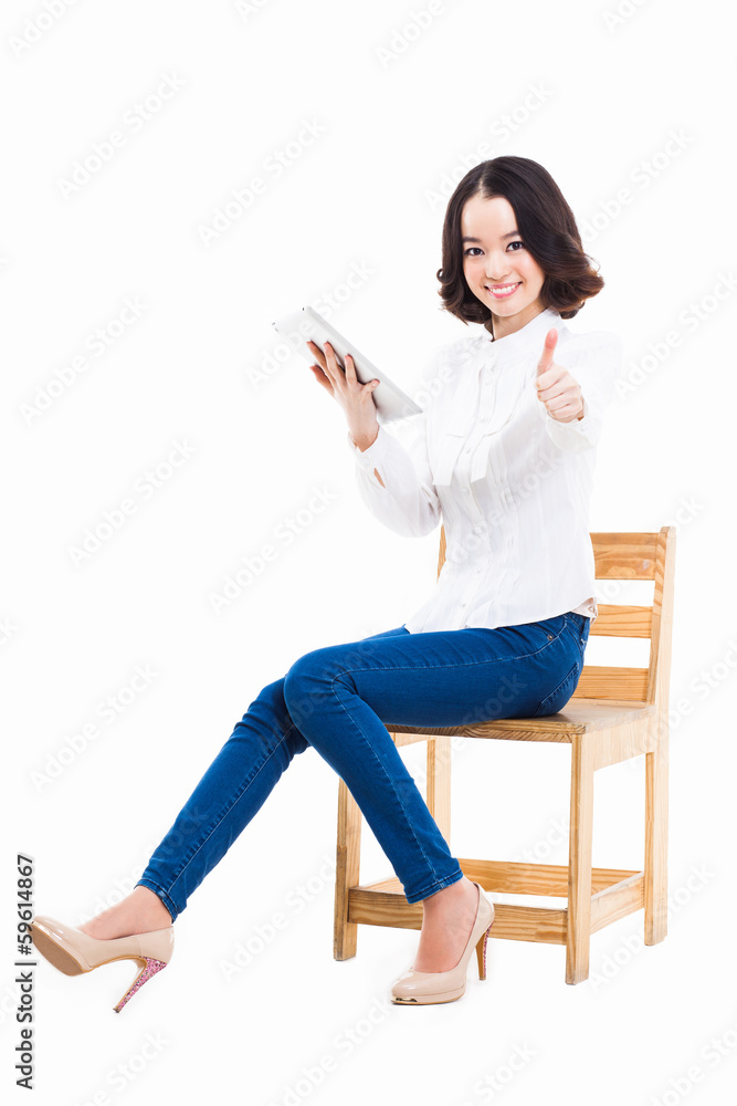 Fototapeta premium Woman holding tablet computer