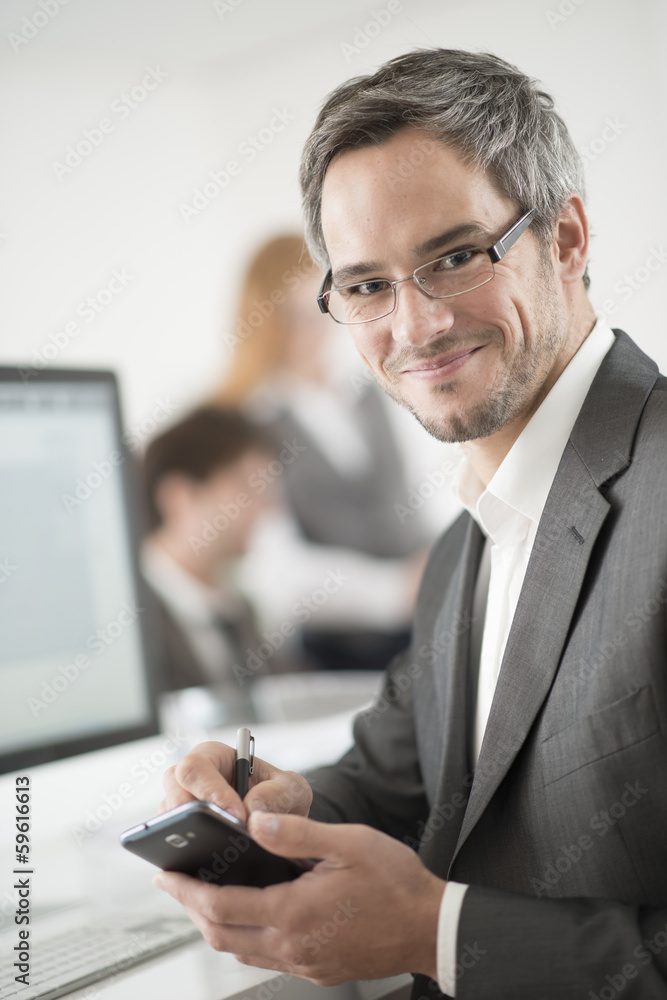 portrait of smiling businessman working with smarphone portrait of smiling businessman working with smarphone