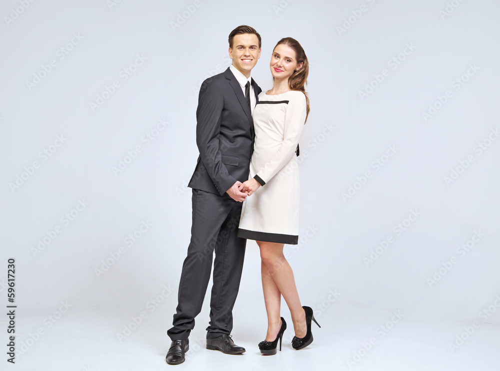Lovely young couple wearing evening clothes Lovely young couple wearing evening clothes
