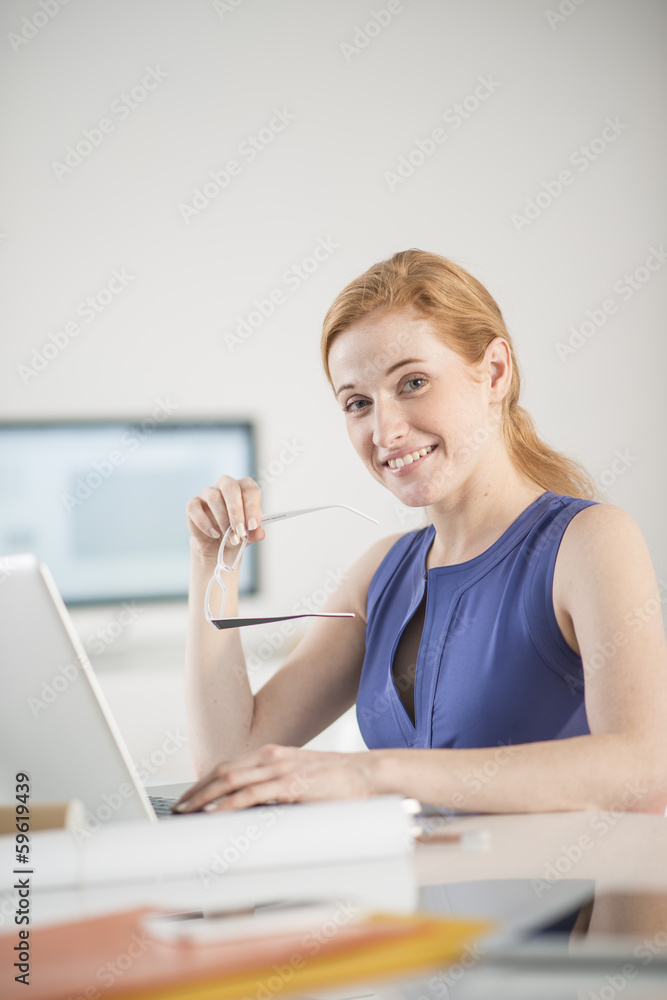 portrait of a beautiful woman in front of a laptop portrait of a beautiful woman in front of a laptop
